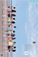 A group of women in bikinis standing on a beach.